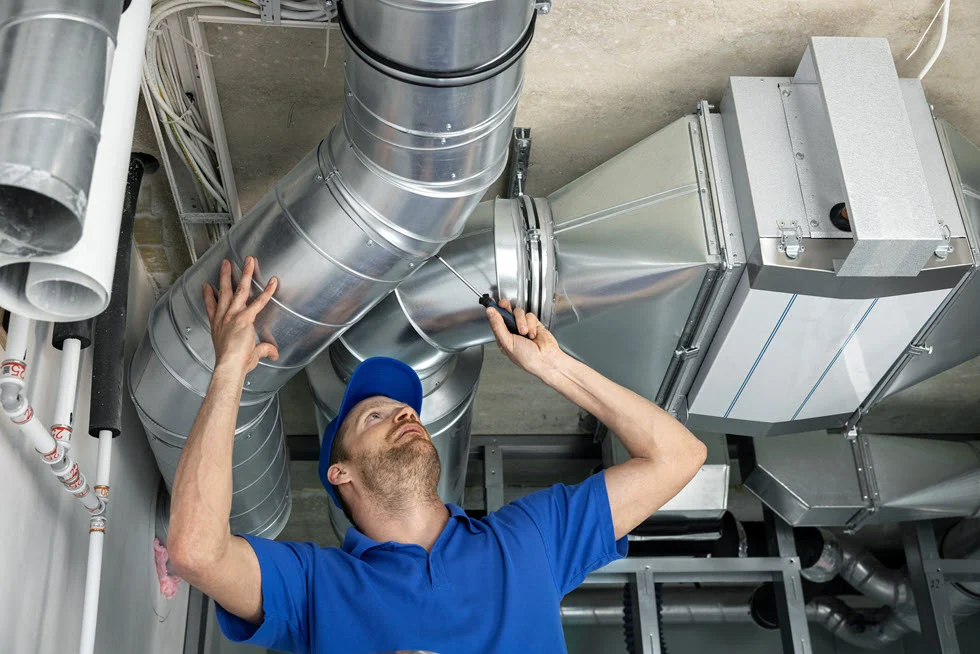 inspecting-air-vents-system central heating riyadh